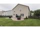 Backyard with a stamped concrete patio, grill, and fenced yard for privacy at 10510 Mcclain Dr, Brownsburg, IN 46112