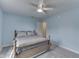 Bedroom with a ceiling fan, bed, and a window letting in natural light at 10510 Mcclain Dr, Brownsburg, IN 46112