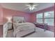 Charming bedroom with a ceiling fan, windows, and a comfortable bed with plush pillows at 10510 Mcclain Dr, Brownsburg, IN 46112