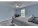 Bedroom featuring a ceiling fan, window, bed, and shoe rack at 10510 Mcclain Dr, Brownsburg, IN 46112