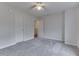Cozy bedroom featuring a ceiling fan, neutral gray carpet and white trim at 10510 Mcclain Dr, Brownsburg, IN 46112