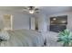 Bright bedroom featuring a ceiling fan, TV, and access to an attached bathroom at 10510 Mcclain Dr, Brownsburg, IN 46112