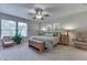 Bright bedroom with a ceiling fan, natural light, and a serene ambiance that creates a relaxing retreat at 10510 Mcclain Dr, Brownsburg, IN 46112