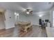 Inviting dining area with a wooden table, chairs, bench seating, adjacent to carpeted stairs at 10510 Mcclain Dr, Brownsburg, IN 46112