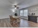 Bright dining area with wood floors, a ceiling fan, coffee bar, and a window for natural light at 10510 Mcclain Dr, Brownsburg, IN 46112