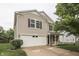 This two-story home includes an attached two-car garage, a covered porch, and manicured landscaping at 10510 Mcclain Dr, Brownsburg, IN 46112