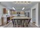 Stylish kitchen featuring an island with seating, plenty of cabinets, and modern stainless steel appliances at 10510 Mcclain Dr, Brownsburg, IN 46112