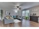 Bright living room with a comfortable sectional sofa, hardwood floors, and modern decor for a cozy atmosphere at 10510 Mcclain Dr, Brownsburg, IN 46112