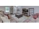 Spacious living room featuring a large sectional, wood-look flooring, and a stylish coffee table at 10510 Mcclain Dr, Brownsburg, IN 46112