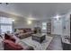Open living space with plush sofas, a stylish rug, and a view of the entryway at 10510 Mcclain Dr, Brownsburg, IN 46112
