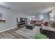 Inviting living room area showcasing comfortable seating, wood floors, and modern decor at 10510 Mcclain Dr, Brownsburg, IN 46112