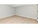 The bedroom in this finished basement features modern wood-look floors and neutral paint at 1053 Millwood Ct # 3, Indianapolis, IN 46260