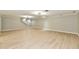 This is a spacious finished basement with wood-look floors and recessed lighting at 1053 Millwood Ct # 3, Indianapolis, IN 46260