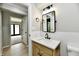 Modern bathroom featuring a wooden vanity, granite countertop, and stylish black hardware at 1053 Millwood Ct # 3, Indianapolis, IN 46260
