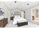Tastefully furnished bedroom with a decorative headboard, stylish decor, and modern lighting at 1053 Millwood Ct # 3, Indianapolis, IN 46260