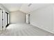 Bright, spacious bedroom with plush carpeting, light gray walls, and access to closet space at 1053 Millwood Ct # 3, Indianapolis, IN 46260