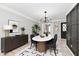 Dining room with modern chandelier, and furniture at 1053 Millwood Ct # 3, Indianapolis, IN 46260