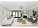 Stylized living room featuring white sofa, fireplace, and stylish furniture at 1053 Millwood Ct # 3, Indianapolis, IN 46260