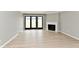 Bright living room featuring fireplace and new vinyl floors at 1053 Millwood Ct # 3, Indianapolis, IN 46260