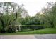 Picturesque backyard with a charming gazebo, serene pond, and lush greenery, perfect for relaxation at 1188 Old Eagle Way, Greenwood, IN 46143
