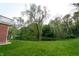 Expansive backyard featuring a serene pond and lush greenery, creating a private oasis at 1188 Old Eagle Way, Greenwood, IN 46143