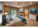Inviting main bedroom featuring a cozy fireplace, calming color palette, and private access to the bathroom at 1188 Old Eagle Way, Greenwood, IN 46143