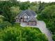 Stunning brick home featuring a gray roof, meticulous landscaping, and an expansive driveway at 1188 Old Eagle Way, Greenwood, IN 46143