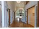 Grand foyer with hardwood floors, staircase, a view of the living room, and high ceilings at 1188 Old Eagle Way, Greenwood, IN 46143