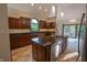 Well-equipped kitchen with custom cabinets, granite countertops, tile flooring and stainless steel appliances at 1188 Old Eagle Way, Greenwood, IN 46143