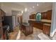 Gourmet kitchen featuring dark wood cabinets, granite countertops, and an island with sink at 1188 Old Eagle Way, Greenwood, IN 46143