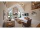 Bright living room features a fireplace, cathedral ceilings, large windows, and neutral decor at 1188 Old Eagle Way, Greenwood, IN 46143