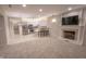 Bright living room open to kitchen features a cozy fireplace and neutral decor at 1188 Old Eagle Way, Greenwood, IN 46143