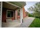 Covered patio area providing a comfortable outdoor living space with brick columns and stone paving at 1188 Old Eagle Way, Greenwood, IN 46143