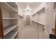Spacious walk-in closet with ample shelving and hanging rods, providing plenty of organized storage space at 1188 Old Eagle Way, Greenwood, IN 46143