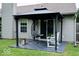 Outdoor patio with seating including hanging chair, white chair, and fire pit overlooking the backyard at 12157 Longstraw Dr, Indianapolis, IN 46236