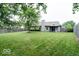 Backyard featuring large grassy area, privacy fence, patio, and the rear of the home at 12157 Longstraw Dr, Indianapolis, IN 46236