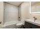 Updated bathroom with tub shower combo, gray subway tile, modern vanity with led lighted mirror at 12157 Longstraw Dr, Indianapolis, IN 46236