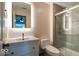 Modern bathroom with a sleek vanity, illuminated mirror and glass-enclosed shower at 12157 Longstraw Dr, Indianapolis, IN 46236