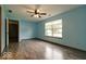 Blue bedroom featuring a large window that fills the room with natural light at 12157 Longstraw Dr, Indianapolis, IN 46236