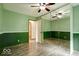 Green bedroom featuring mirrored closet doors and large windows at 12157 Longstraw Dr, Indianapolis, IN 46236