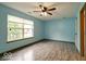 Bright bedroom featuring a large window that fills the room with natural light at 12157 Longstraw Dr, Indianapolis, IN 46236