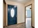 Inviting foyer with a decorative front door, wood-look flooring, and trim accents at 12157 Longstraw Dr, Indianapolis, IN 46236
