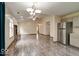 Inviting living room featuring a fireplace, hardwood floors and an open concept layout at 12157 Longstraw Dr, Indianapolis, IN 46236