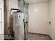 Picture of the utility room showing the water heater and HVAC unit at 12157 Longstraw Dr, Indianapolis, IN 46236