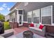 Relaxing back deck with comfortable seating and a modern fire pit, perfect for gatherings at 1313 Brentford Ln, Greenwood, IN 46143