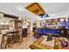 Basement entertainment area with custom bar, unique accents, and inviting seating at 1313 Brentford Ln, Greenwood, IN 46143