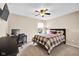 Cozy bedroom featuring a ceiling fan, carpet, and a desk for a comfortable workspace at 1313 Brentford Ln, Greenwood, IN 46143