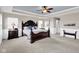 Spacious main bedroom with elegant dark wood furniture, neutral walls, and trim details at 1313 Brentford Ln, Greenwood, IN 46143