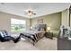 Comfortable bedroom with a lounge chair and window offering plenty of natural light at 1313 Brentford Ln, Greenwood, IN 46143