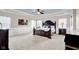 Expansive main bedroom with a dark wood four poster bed and light blue accent ceiling at 1313 Brentford Ln, Greenwood, IN 46143